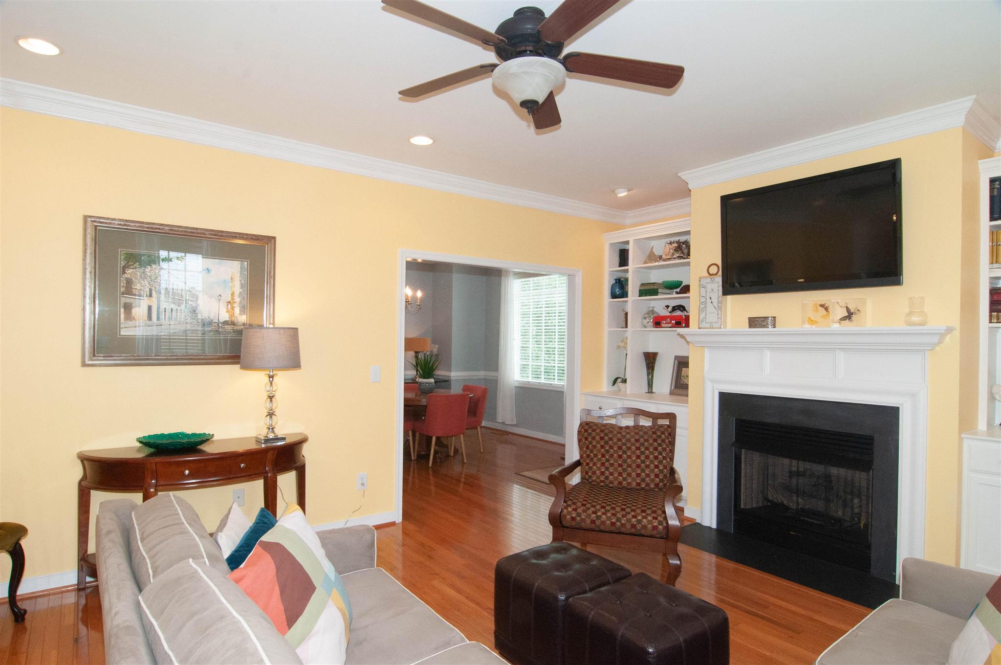 1265 Amber Ridge Road Charlottesville, VA 22901 - Photo 7 of 44 a living room with furniture a flat screen tv and a fireplace