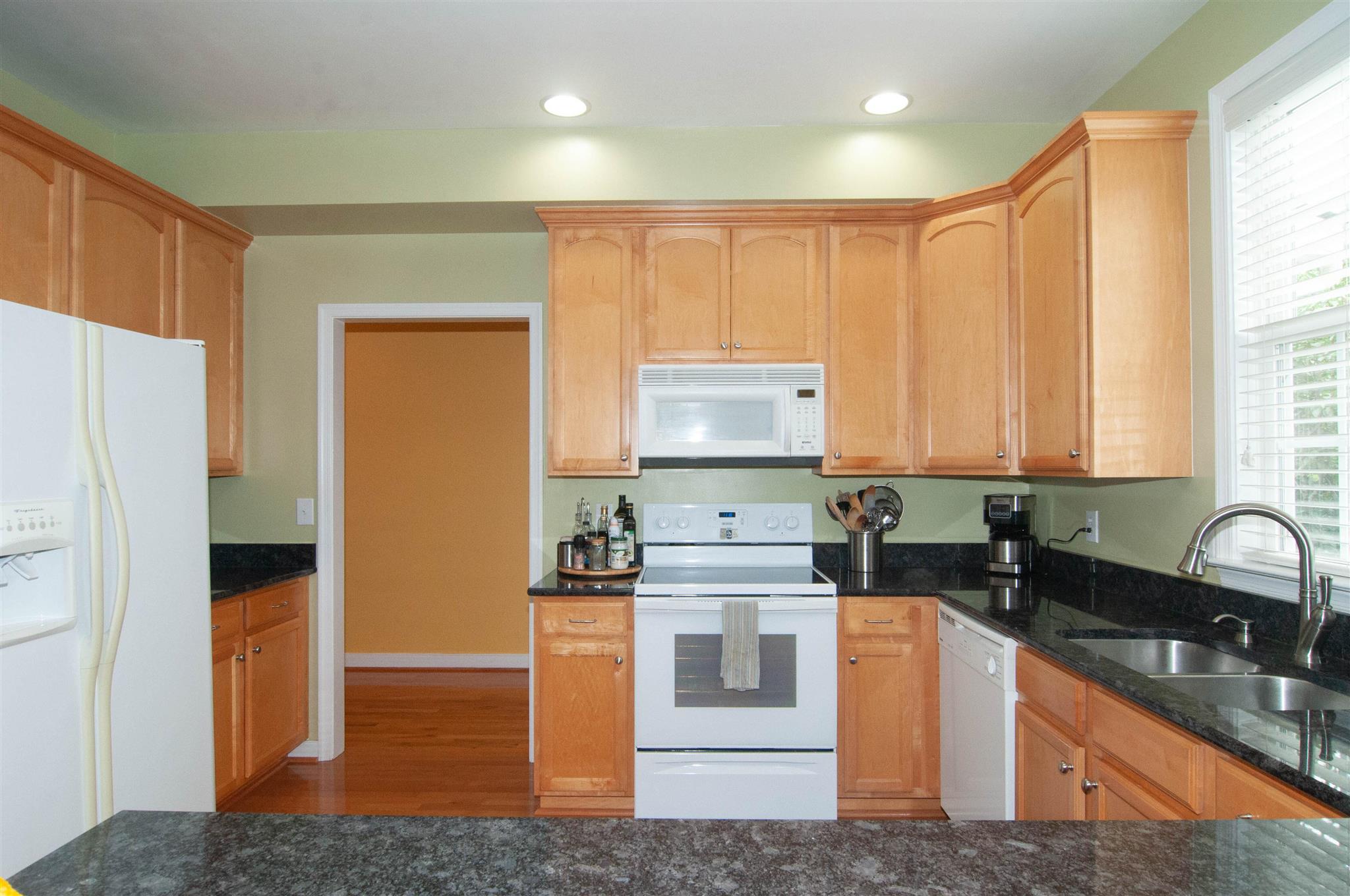 1265 Amber Ridge Road Charlottesville, VA 22901 - Photo 10 of 44 a kitchen with stainless steel appliances granite countertop a sink stove and refrigerator