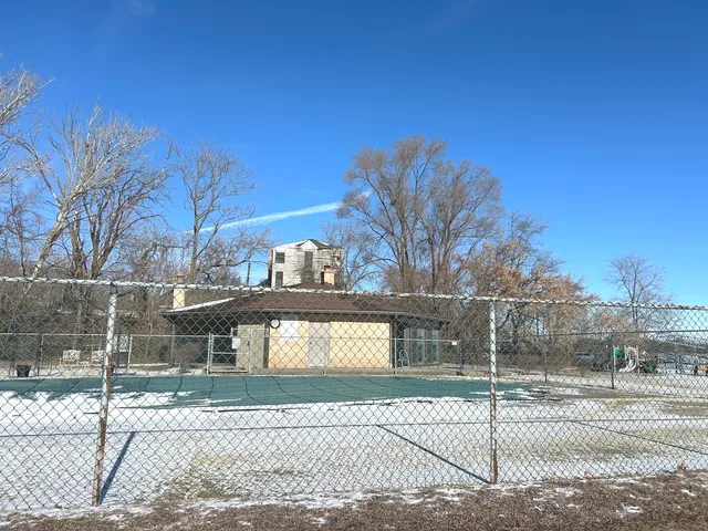 a view of a street with a building in the background