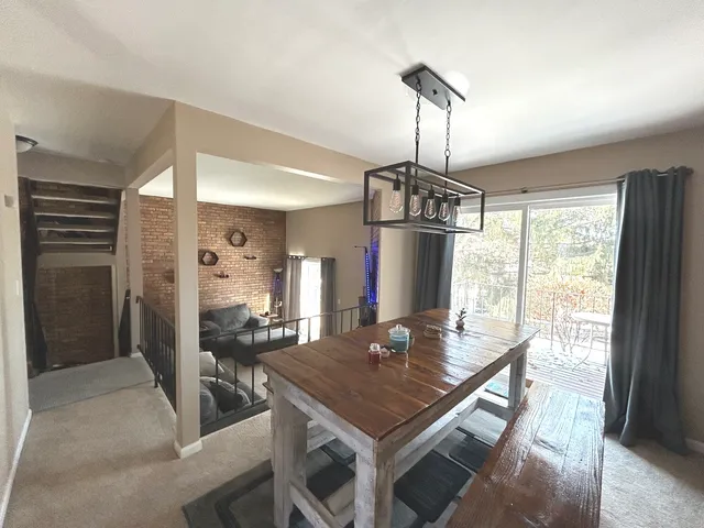 a view of a dining room with furniture window and outside view