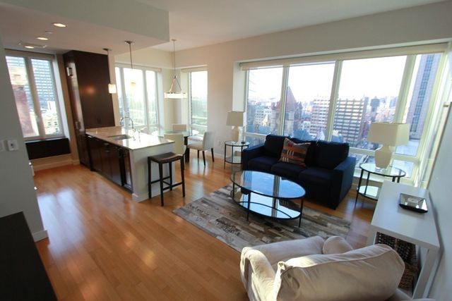 a view of bedroom with a closet and wooden floor