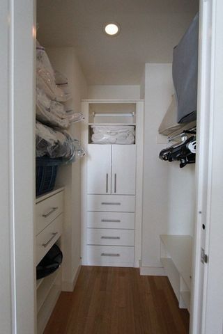 a bathroom with a granite countertop sink a toilet and shower
