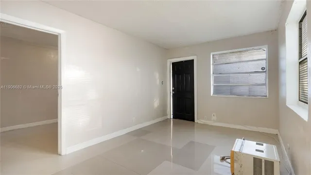 a view of an empty room and window