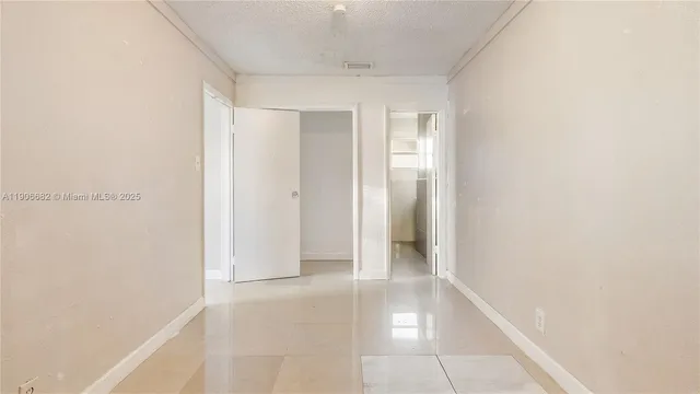 a white bath tub sitting next to a white toilet