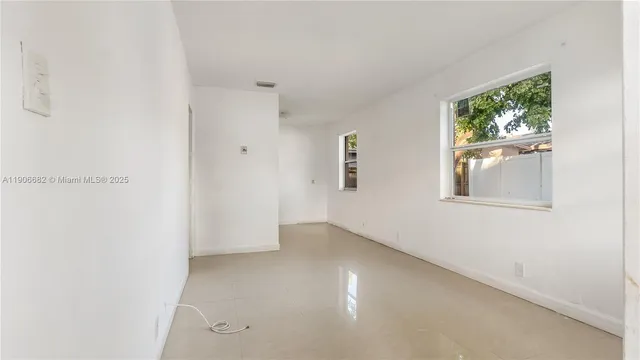 an empty room with windows