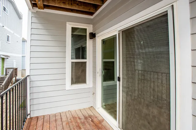 a view of a door and a window