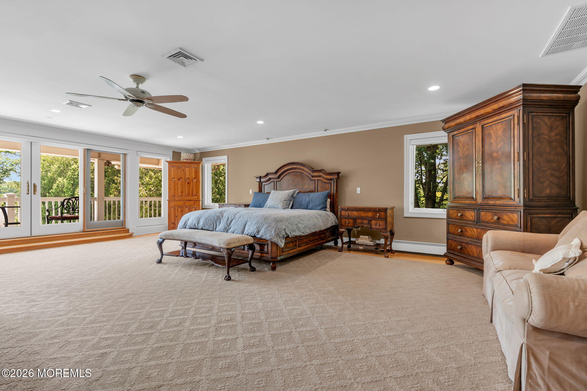672 Winding River Road Brick, NJ 08724 - Photo 38 of 111 a spacious bedroom with a bed and a couch