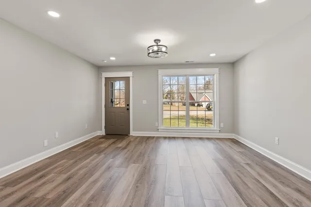 a kitchen with a refrigerator and a sink