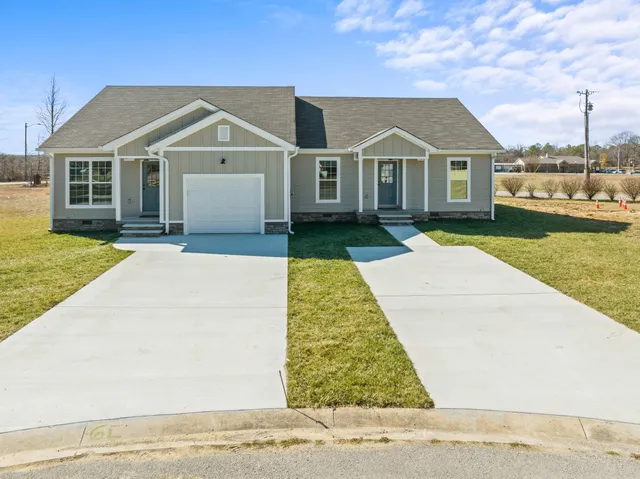 a view of house with yard
