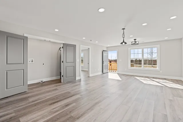 a kitchen with granite countertop white cabinets and stainless steel appliances