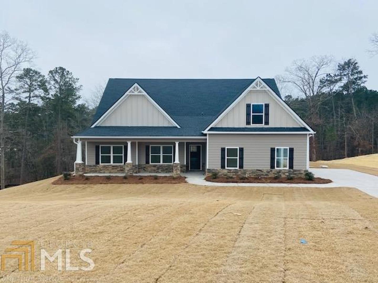 210 River Point Road, Unit 3 Jackson, GA 30233 - Photo 1 of 1 a front view of a house with a yard