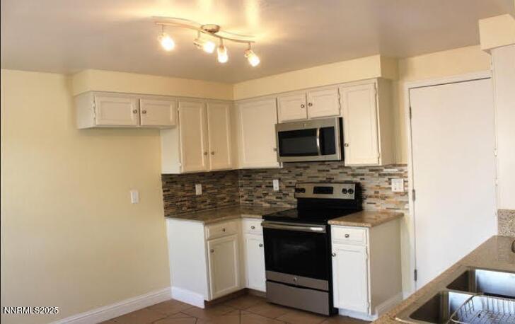 1218 Junction Drive Sparks, NV 89434 - Photo 7 of 19 a kitchen with a stove and a microwave