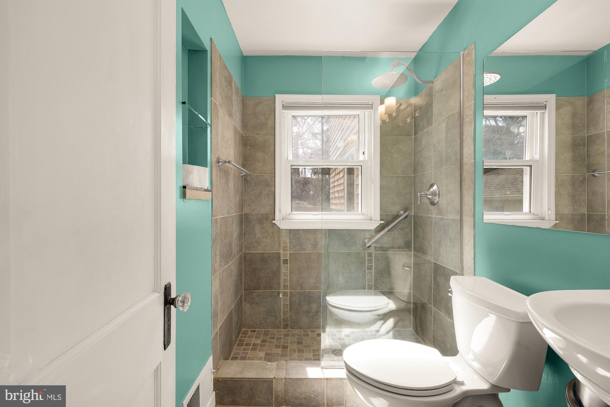 6112 Madawaska Road Bethesda, MD 20816 - Photo 11 of 56 a bathroom with a toilet a sink and shower