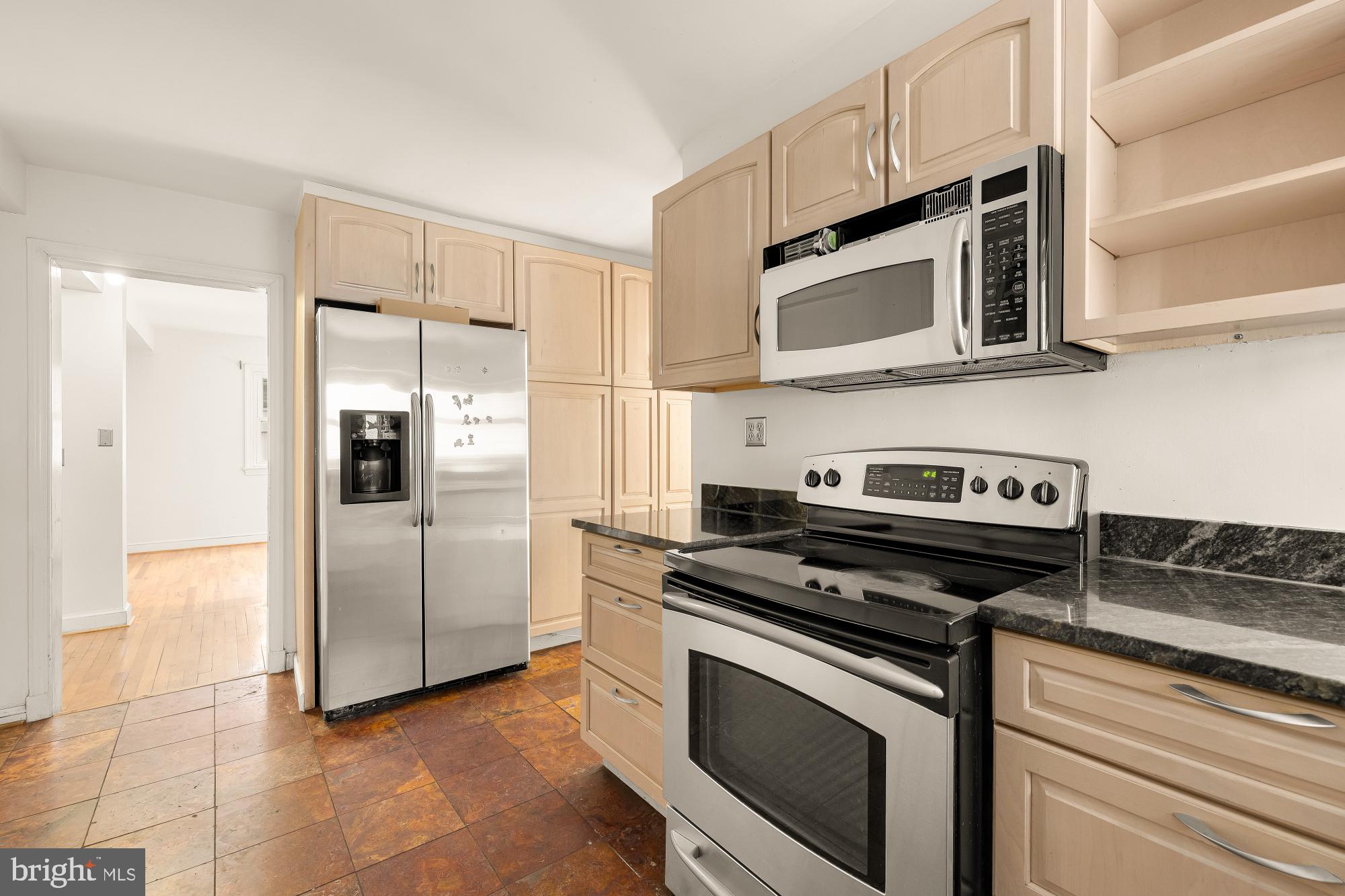 6112 Madawaska Road Bethesda, MD 20816 - Photo 17 of 56 a kitchen with stainless steel appliances granite countertop a stove and a refrigerator