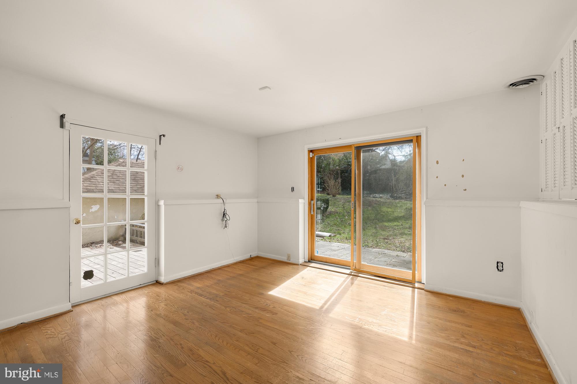 6112 Madawaska Road Bethesda, MD 20816 - Photo 18 of 56 wooden floor in an empty room with a window