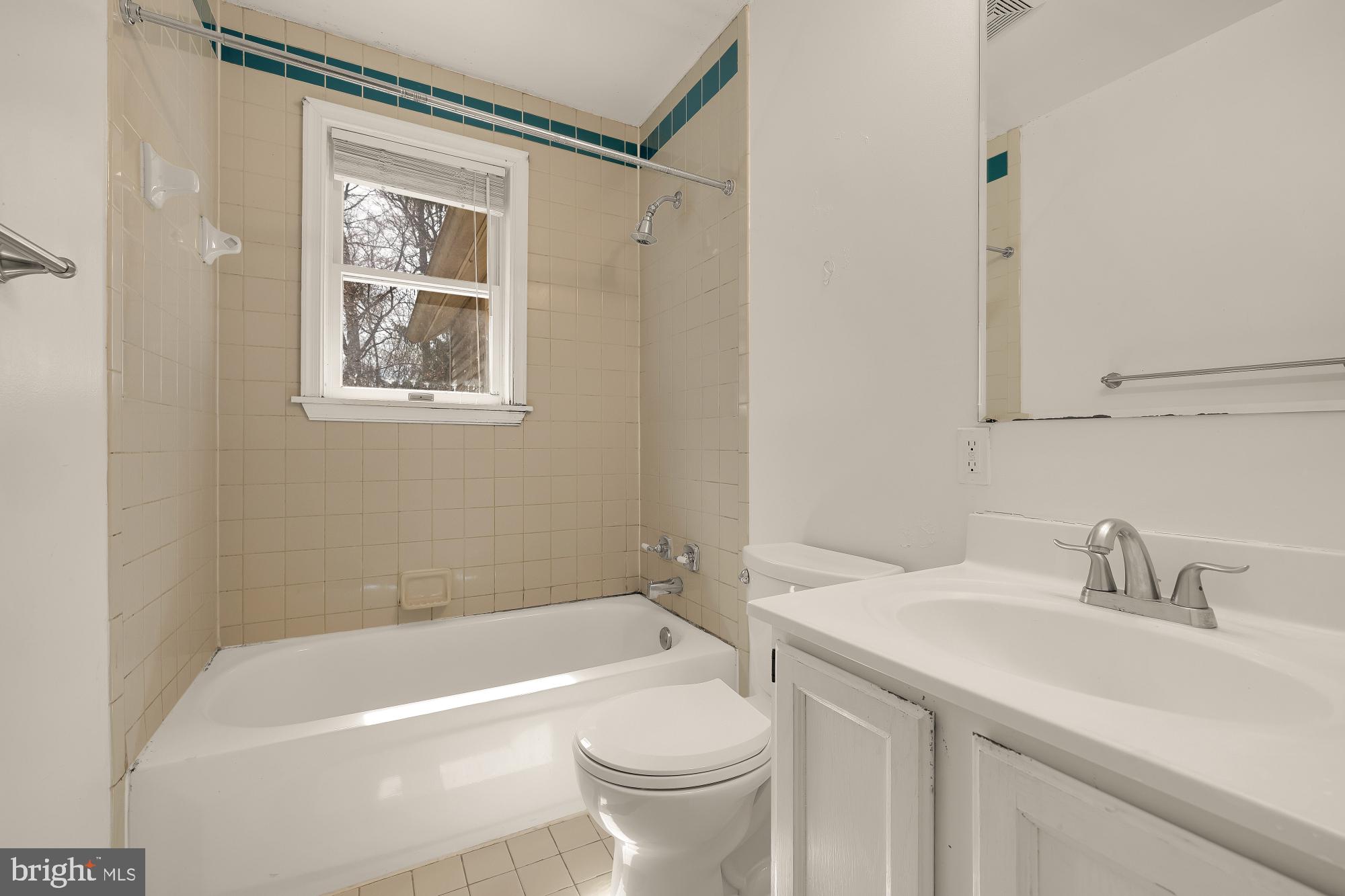 6112 Madawaska Road Bethesda, MD 20816 - Photo 23 of 56 a bathroom with a sink a toilet and shower