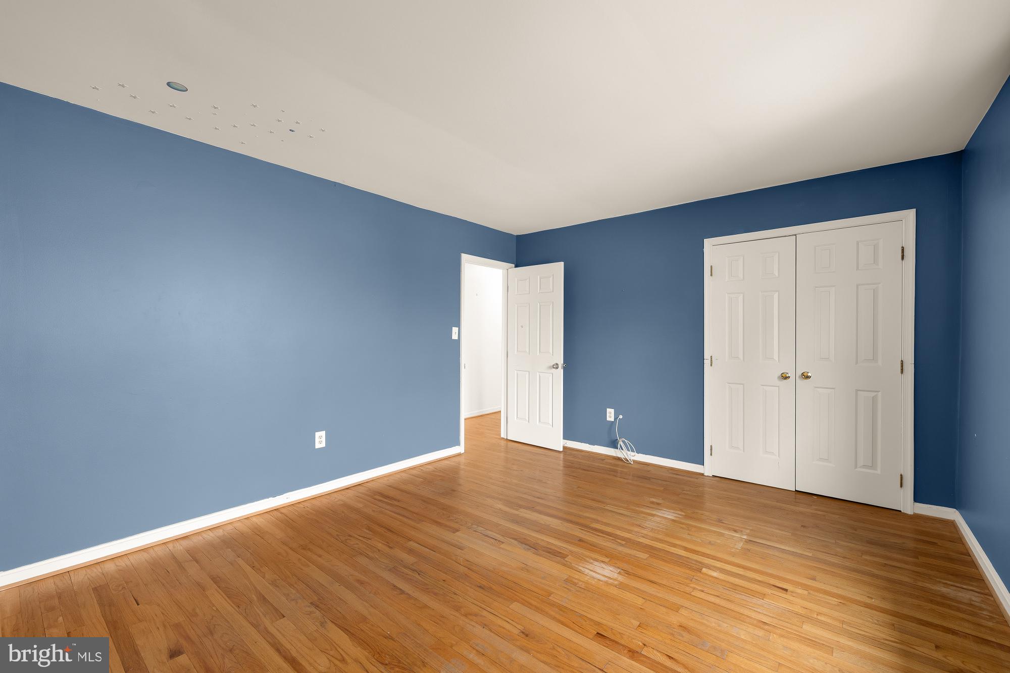 6112 Madawaska Road Bethesda, MD 20816 - Photo 25 of 56 a view of an empty room with wooden floor