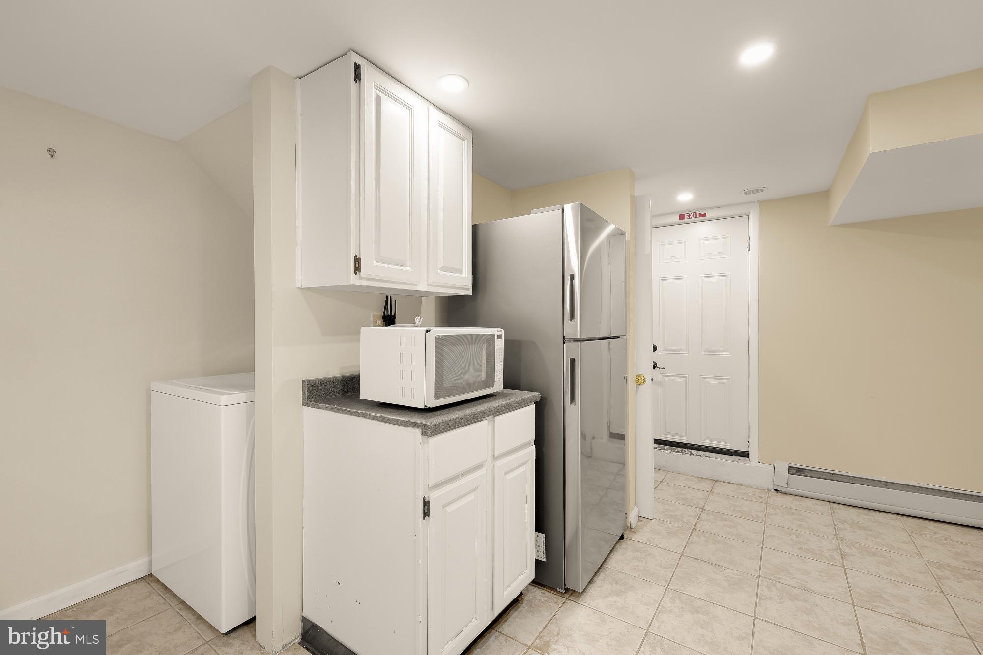 6112 Madawaska Road Bethesda, MD 20816 - Photo 36 of 56 a kitchen with stainless steel appliances granite countertop a refrigerator and a sink