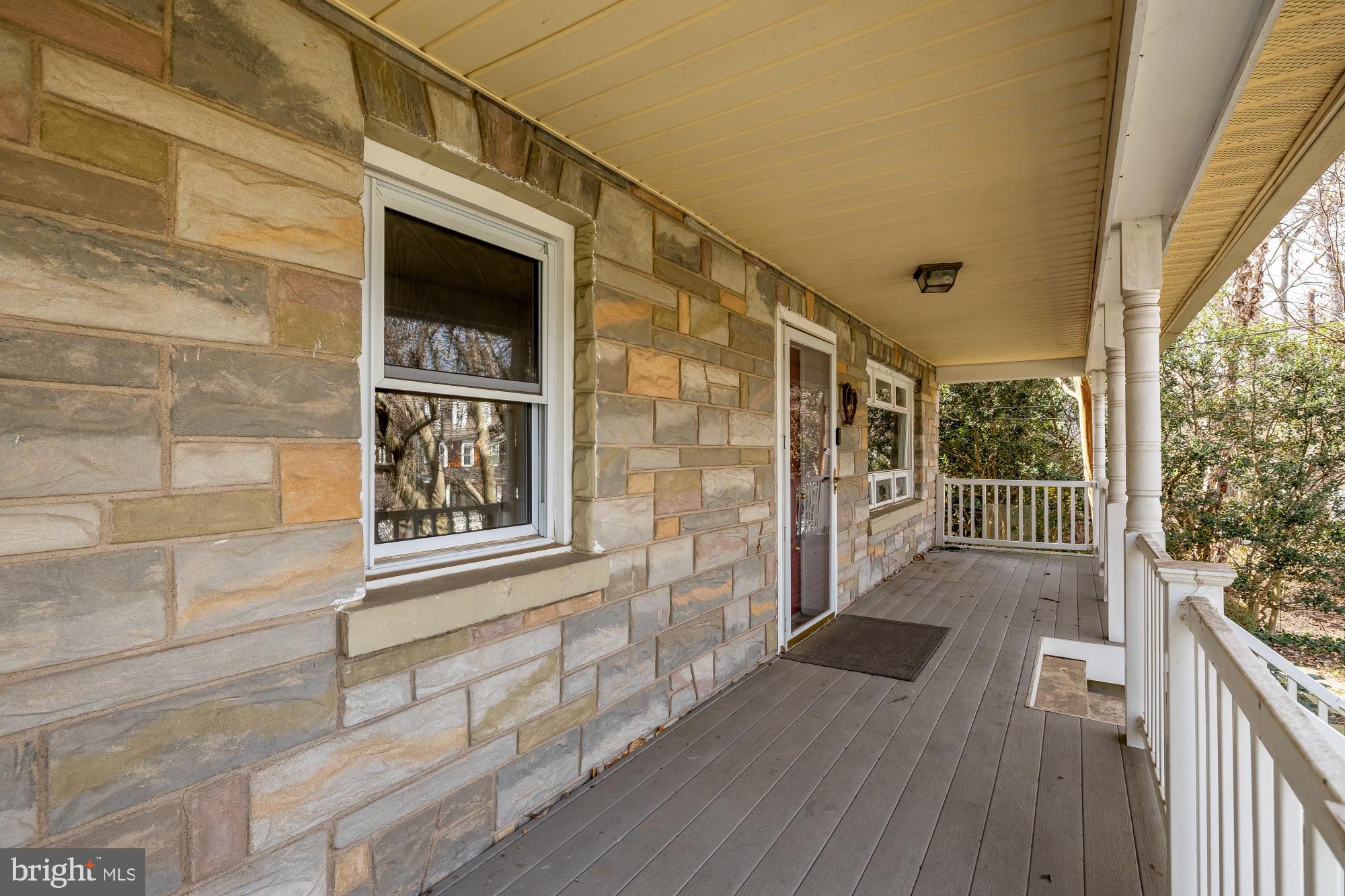 6112 Madawaska Road Bethesda, MD 20816 - Photo 4 of 56 a view of a house with a porch