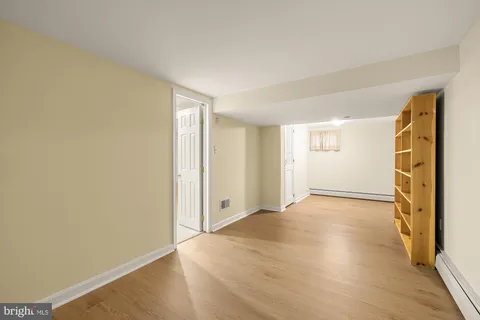 a view of a fireplace with a door and a fireplace