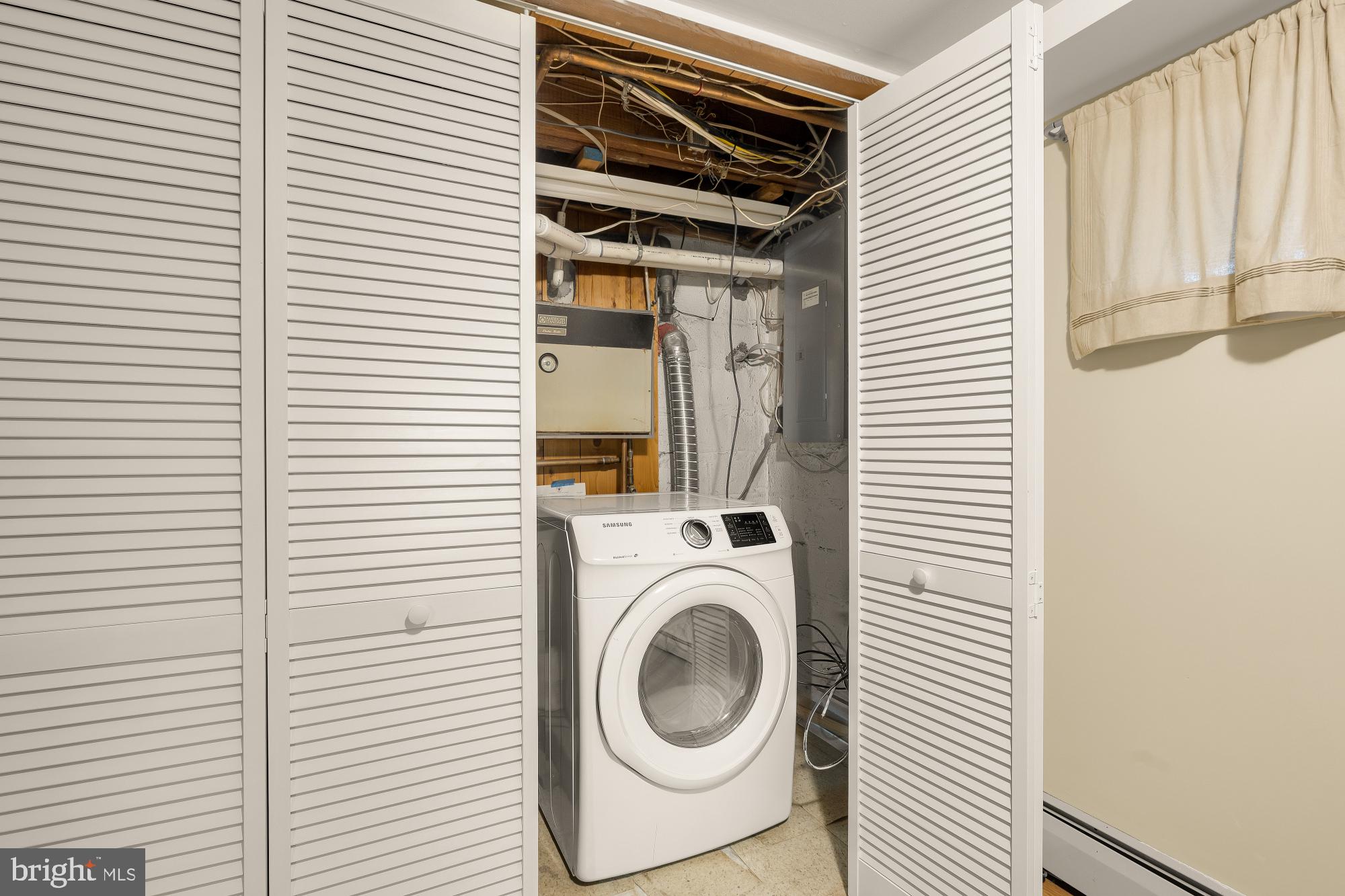 6112 Madawaska Road Bethesda, MD 20816 - Photo 45 of 56 a utility room with dryer and washer