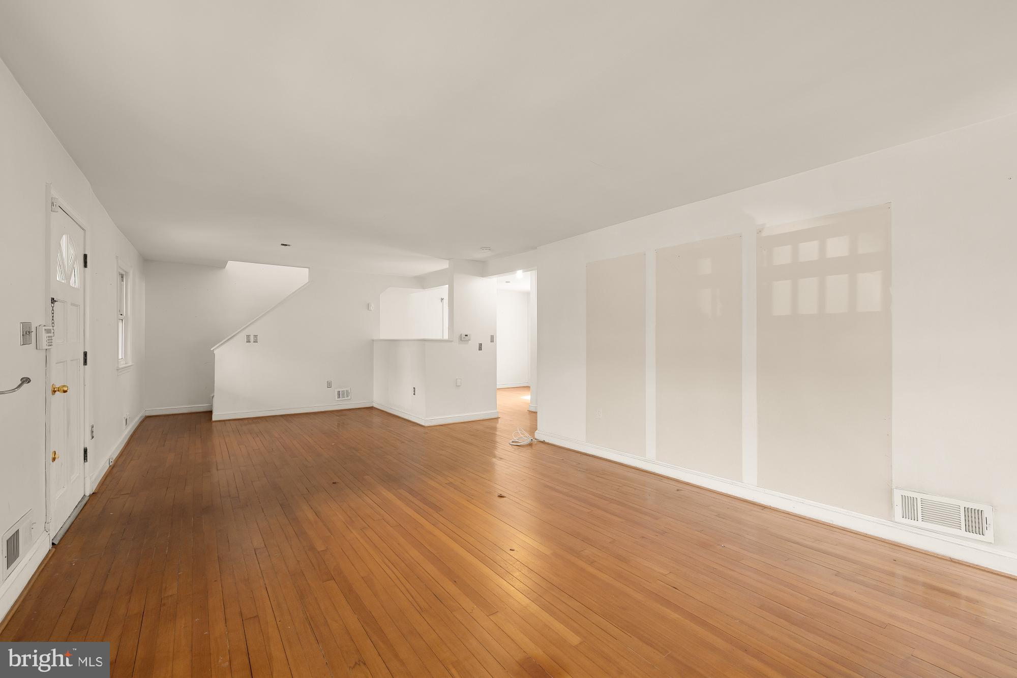 6112 Madawaska Road Bethesda, MD 20816 - Photo 9 of 56 a view of empty room with wooden floor and fan