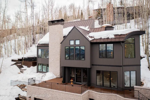 a front view of a building with a yard