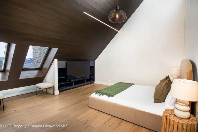 a living room with furniture and a clock