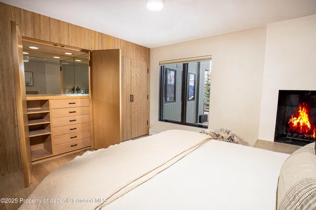 a bedroom with a bed and dresser