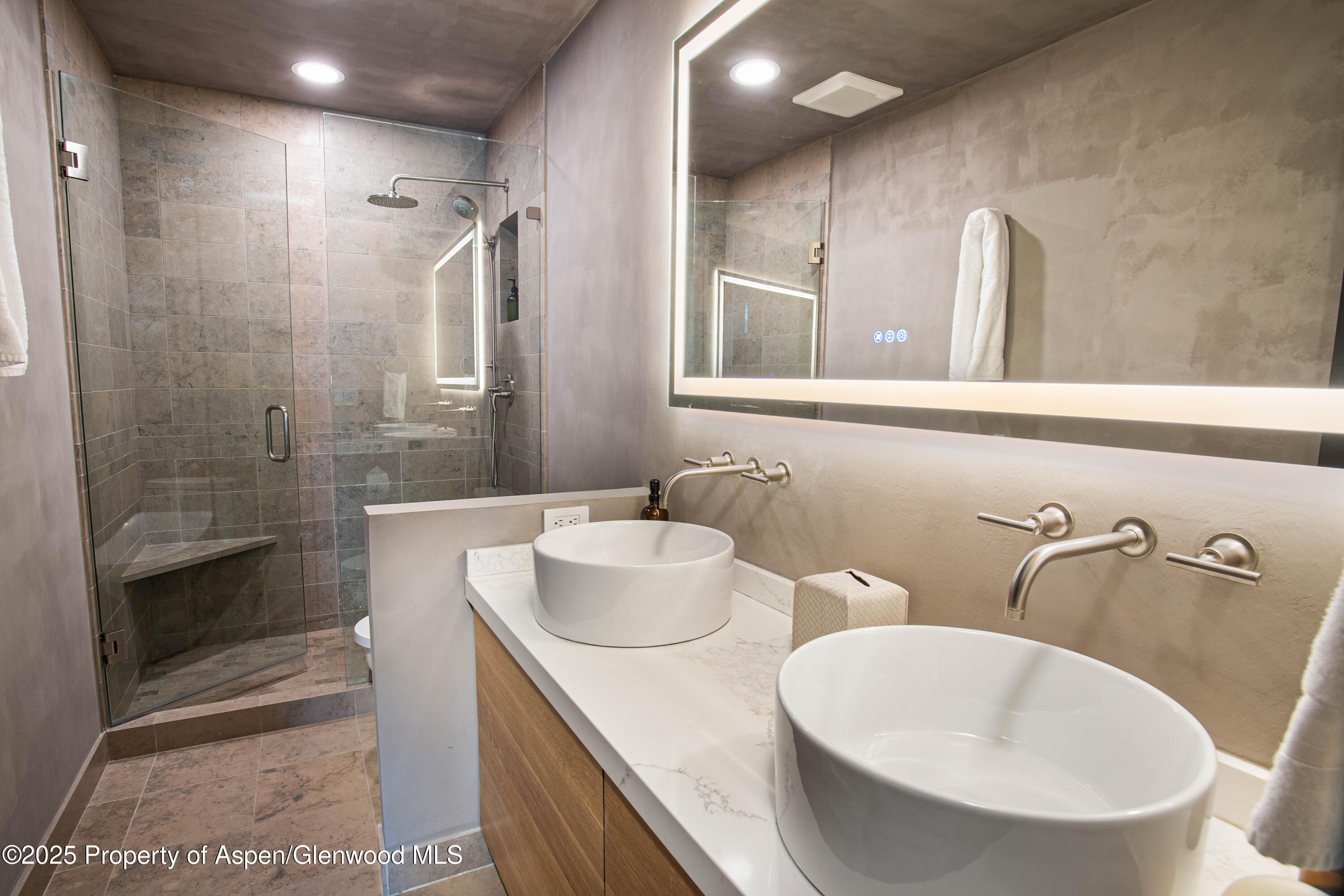 306 Edgewood Lane Snowmass Village, CO 81615 - Photo 17 of 41 a bathroom with 2 sink and a bathtub
