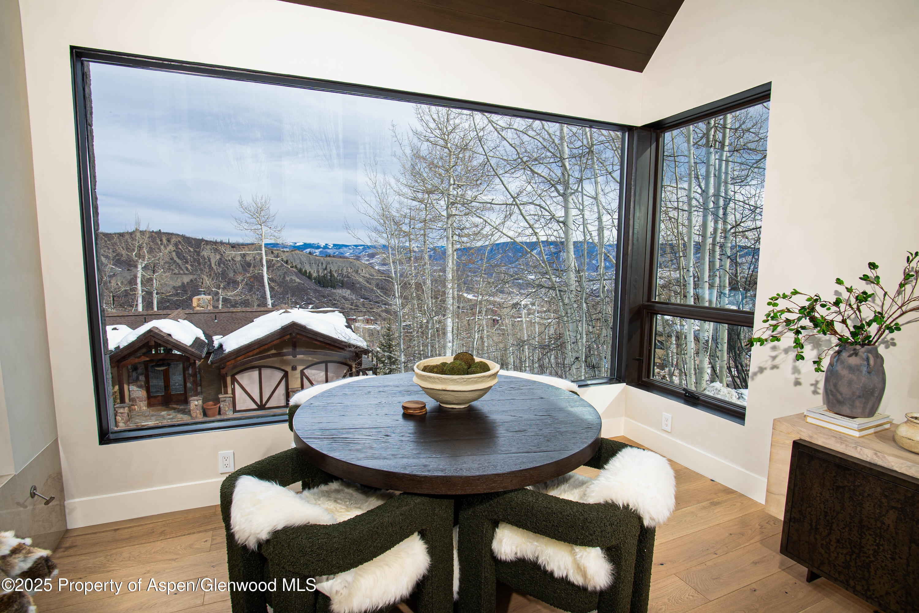 306 Edgewood Lane Snowmass Village, CO 81615 - Photo 31 of 41 a dining room with furniture and a floor to ceiling window