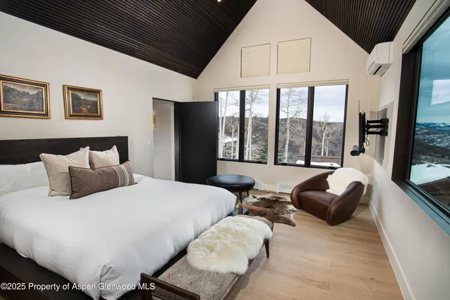 a dining room with a large window and a table