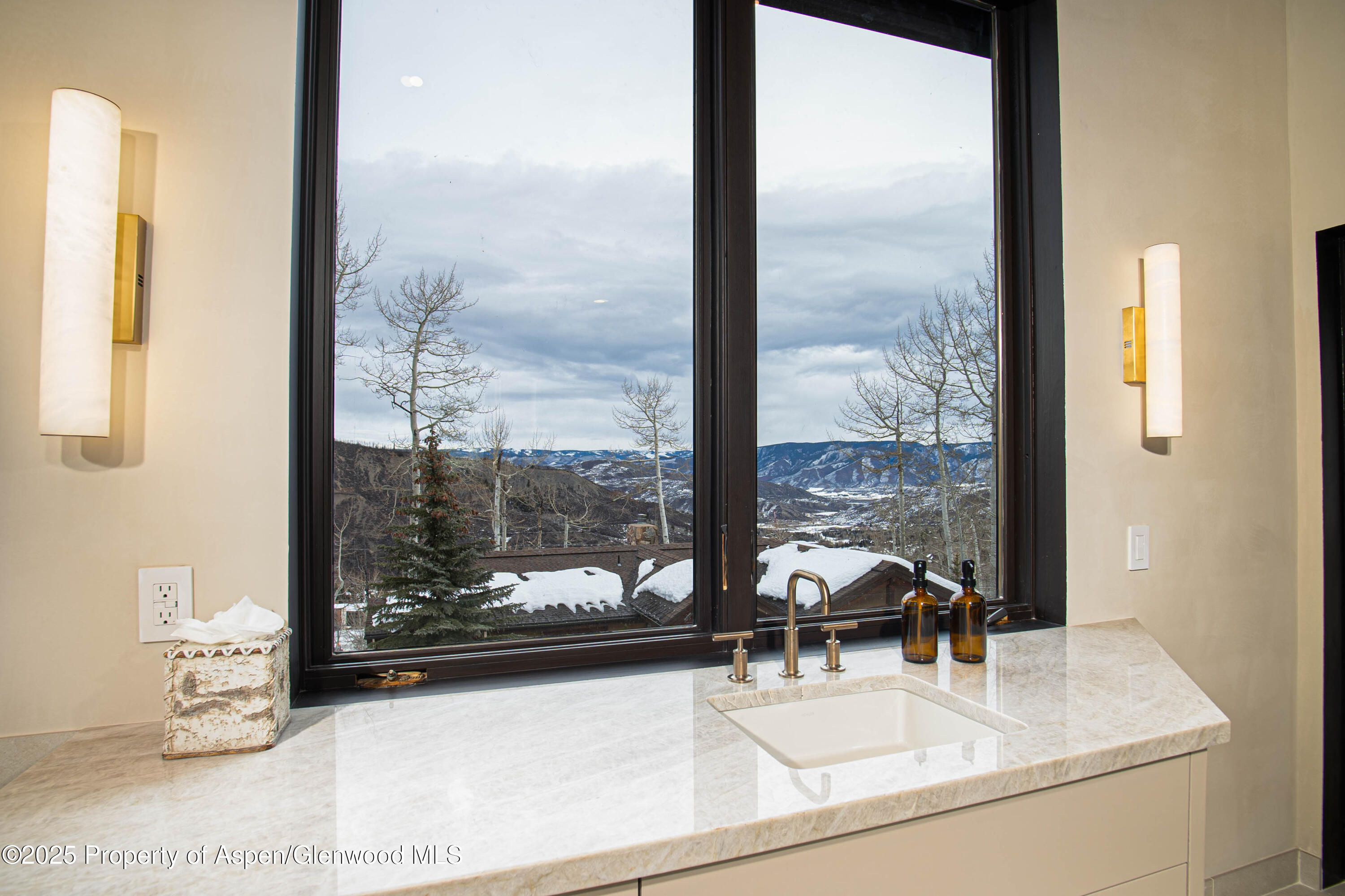 306 Edgewood Lane Snowmass Village, CO 81615 - Photo 38 of 41 a dining room with a large window and a table