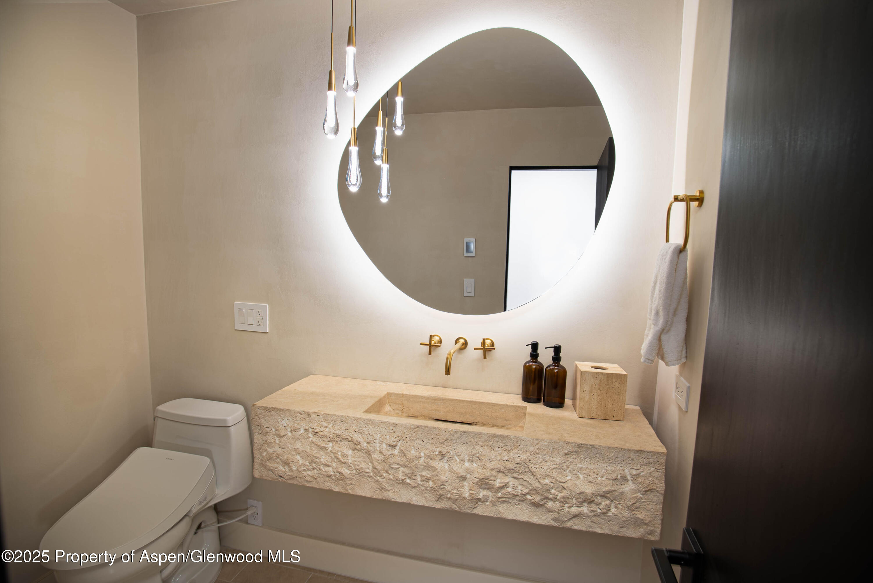 306 Edgewood Lane Snowmass Village, CO 81615 - Photo 39 of 41 a bathroom with a toilet sink and mirror