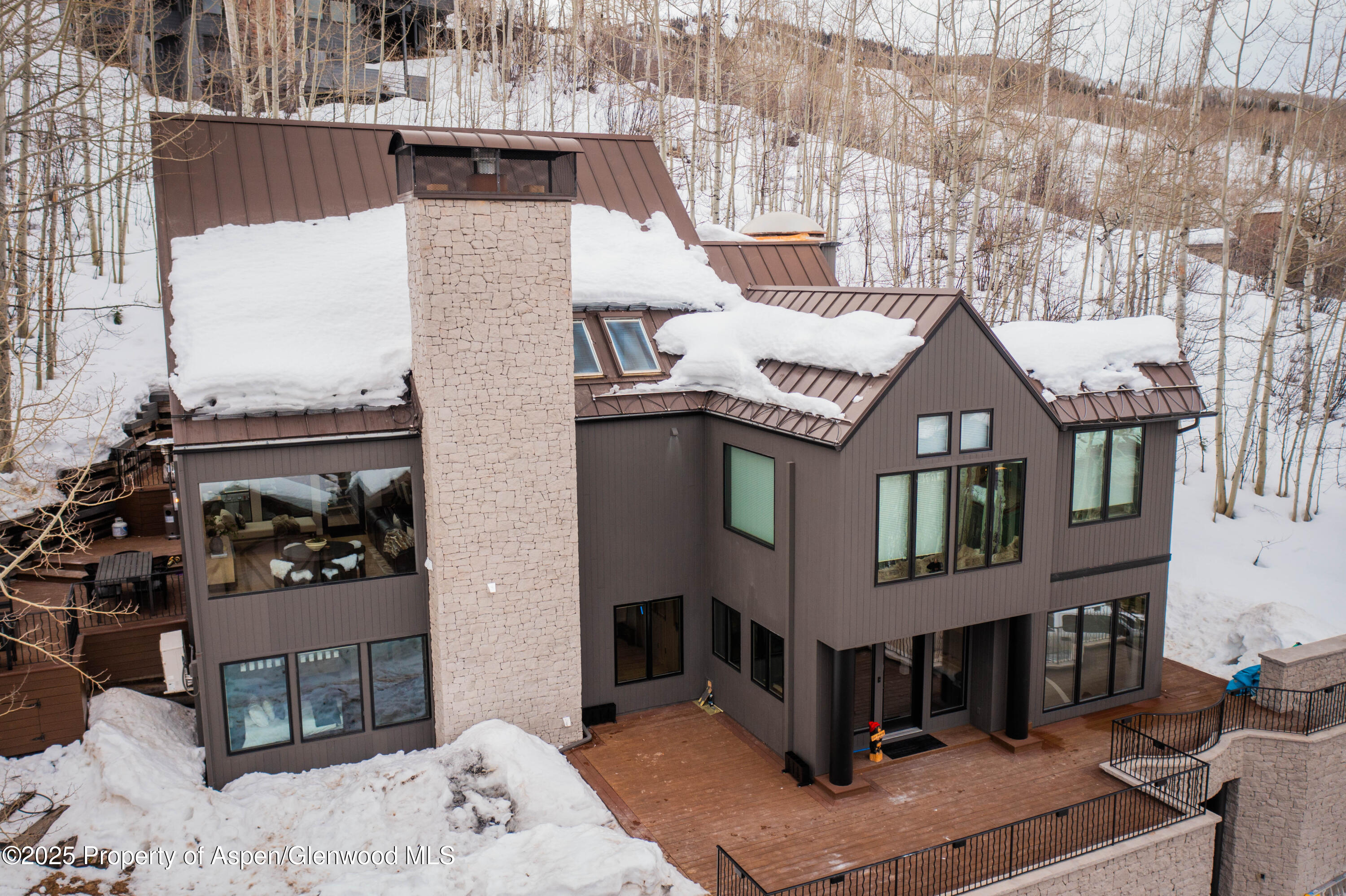 306 Edgewood Lane Snowmass Village, CO 81615 - Photo 41 of 41 a front view of a house with a yard