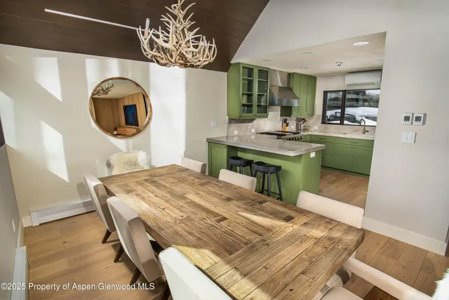 a kitchen with a table and chairs
