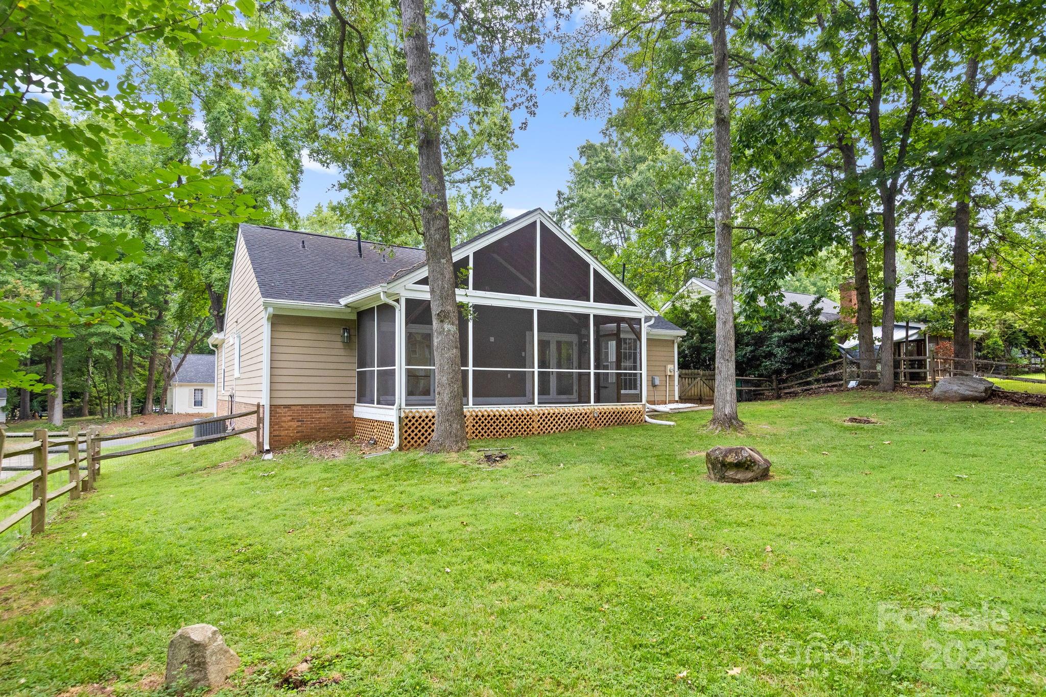 8806 Golf Ridge Drive Charlotte, NC 28277 - Photo 18 of 22 a view of a house with a backyard