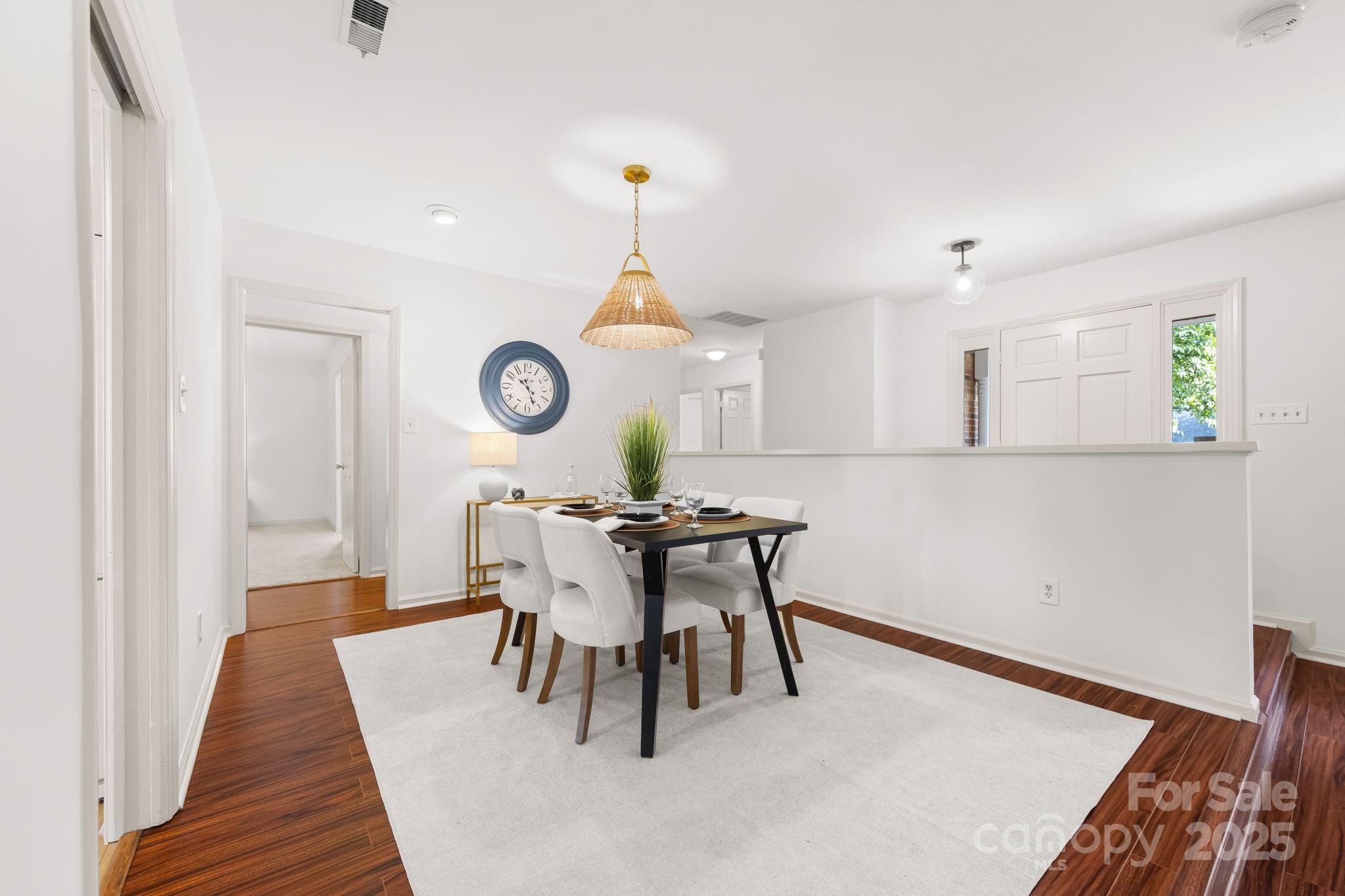 8806 Golf Ridge Drive Charlotte, NC 28277 - Photo 5 of 22 a view of a dining room with furniture and wooden floor