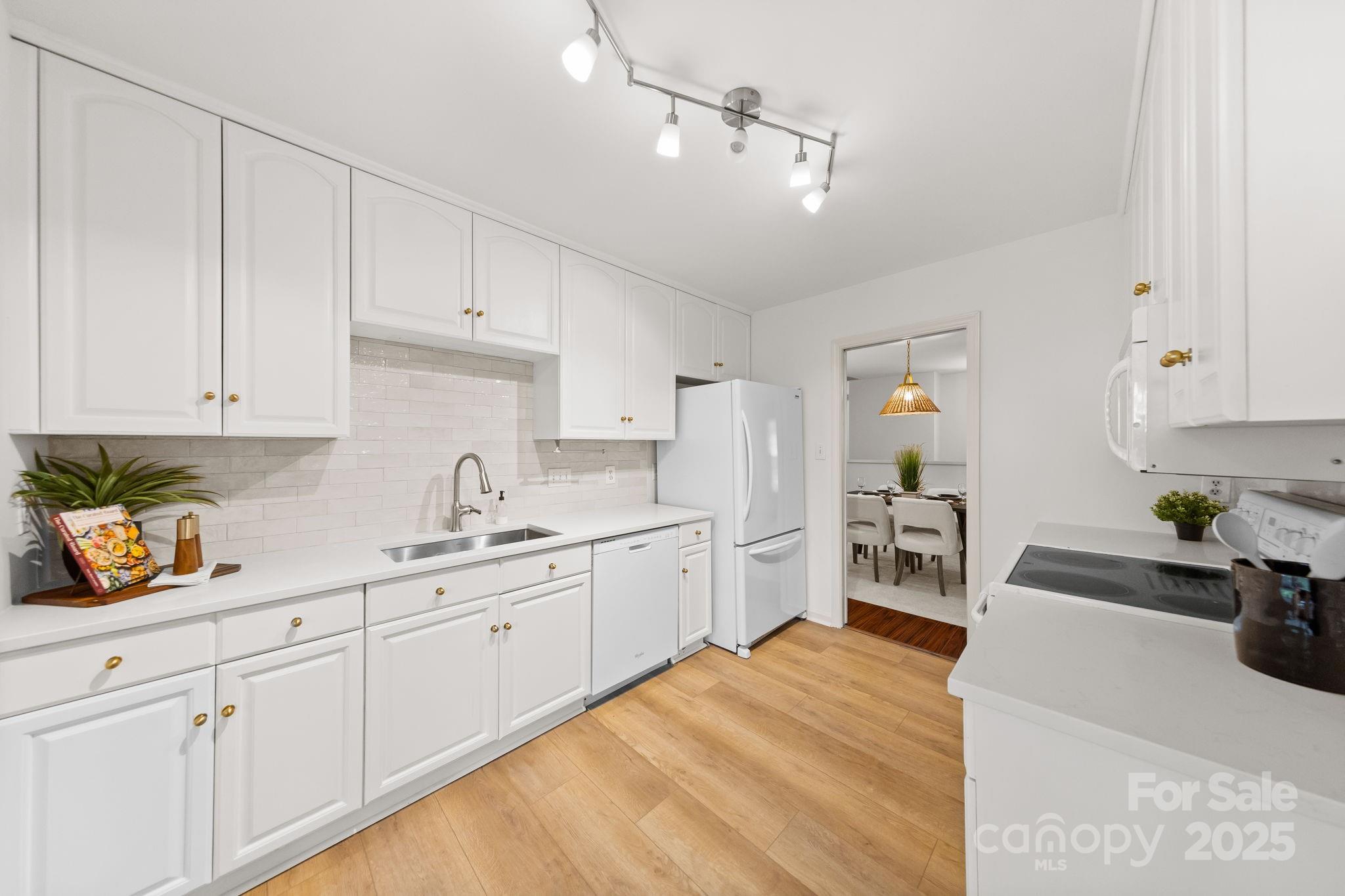 8806 Golf Ridge Drive Charlotte, NC 28277 - Photo 7 of 22 a kitchen with sink and cabinets