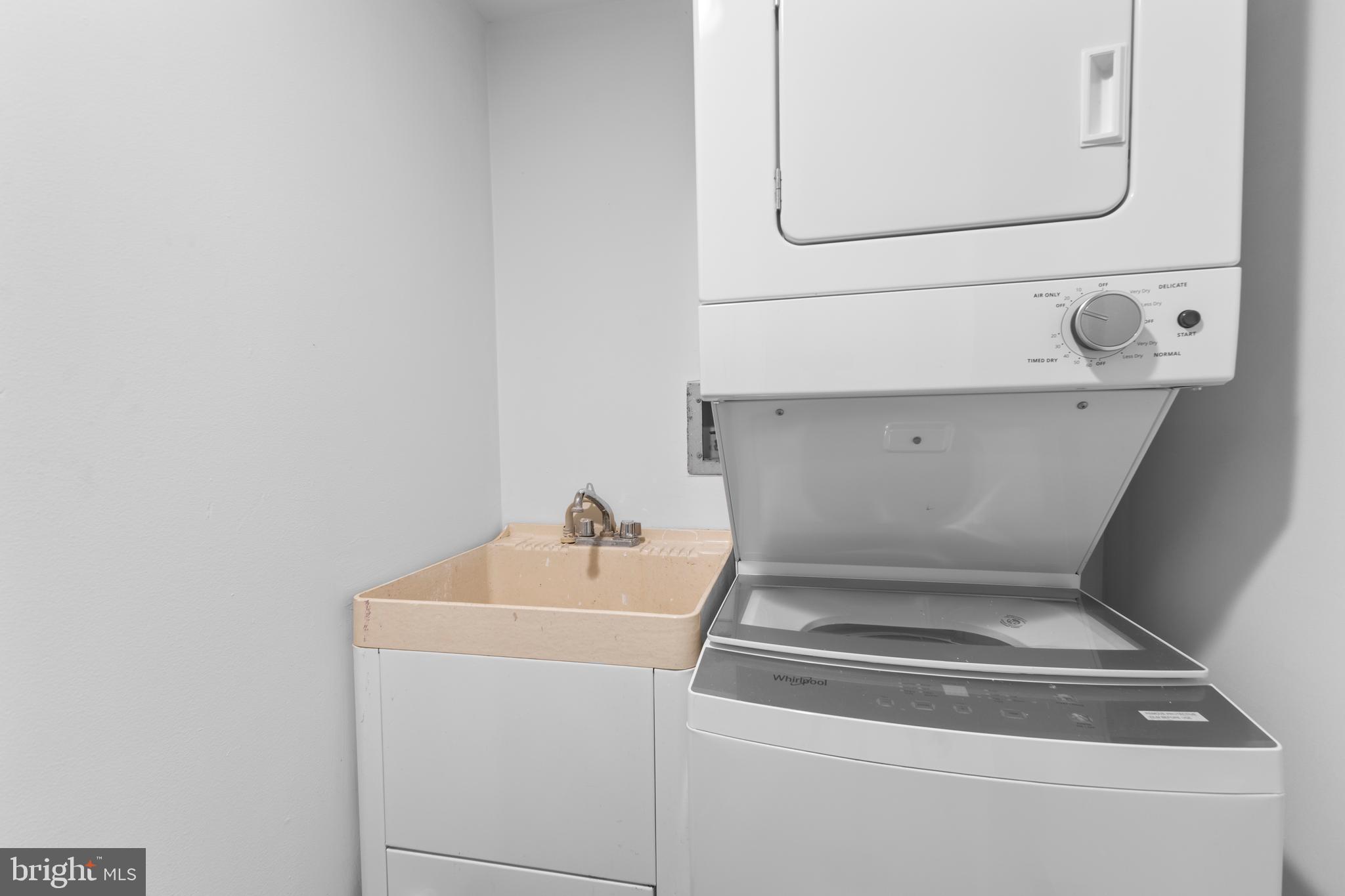 1099 22nd Street Northwest, Unit 807 Washington, DC 20037 - Photo 17 of 34 a utility room with dryer and washer