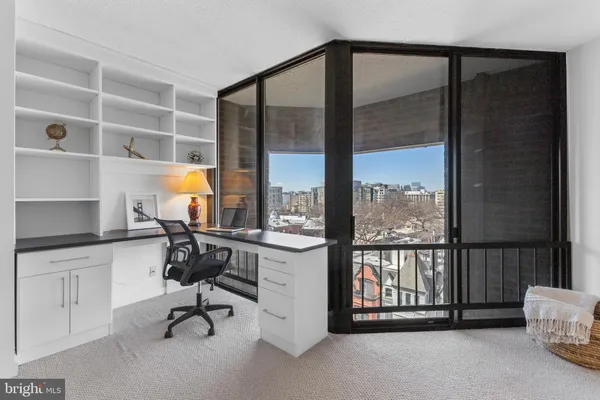 a bed room with a bed and a chair