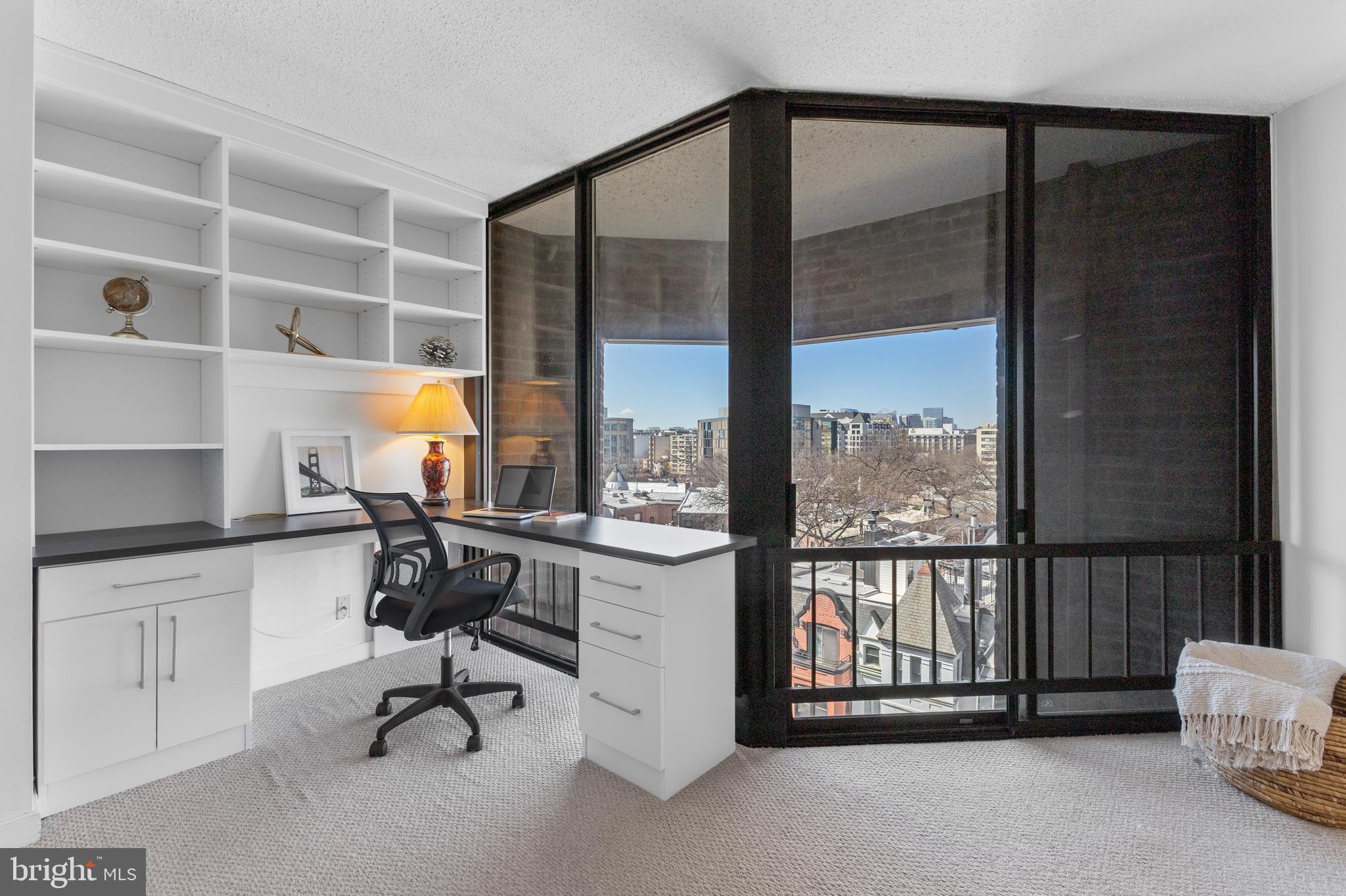 1099 22nd Street Northwest, Unit 807 Washington, DC 20037 - Photo 23 of 34 a view of a workspace with furniture and a window