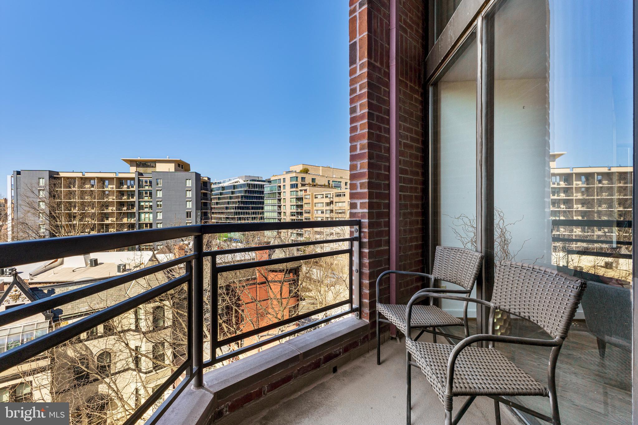 1099 22nd Street Northwest, Unit 807 Washington, DC 20037 - Photo 9 of 34 a view of balcony with a couple of chairs