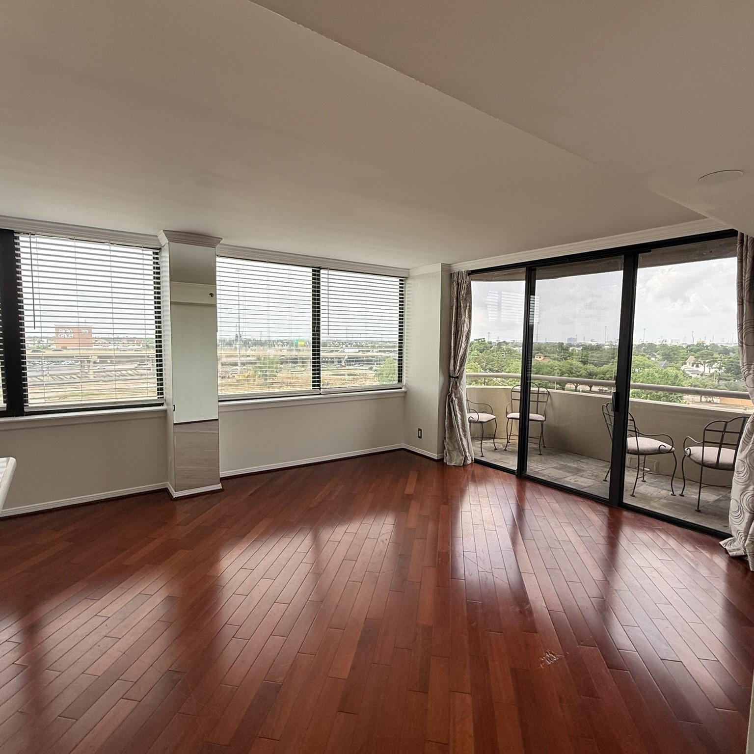 3525 Sage Road, Unit 716 Houston, TX 77056 - Photo 5 of 26 wooden floor in an empty room with a window