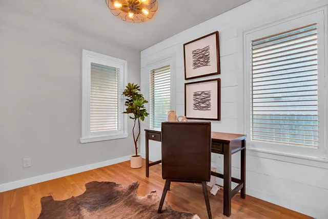 a view of a livingroom with furniture and window