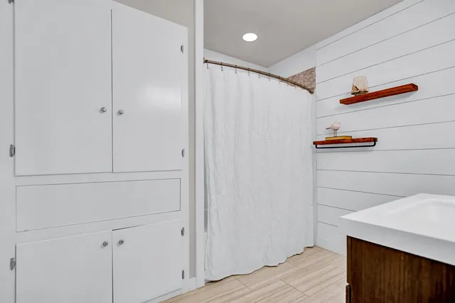 a view of storage and utility room with closet