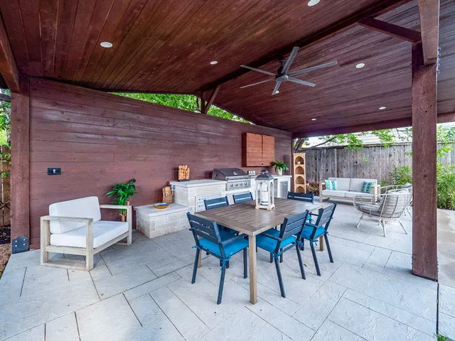 a patio with a table and chairs