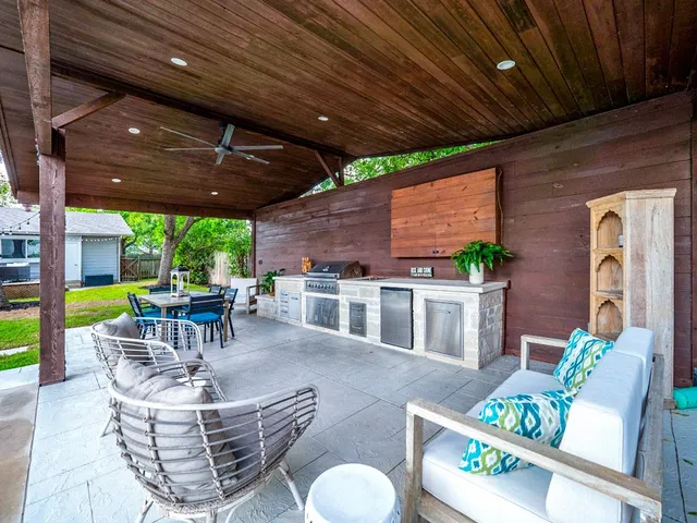 a patio with a table and chairs