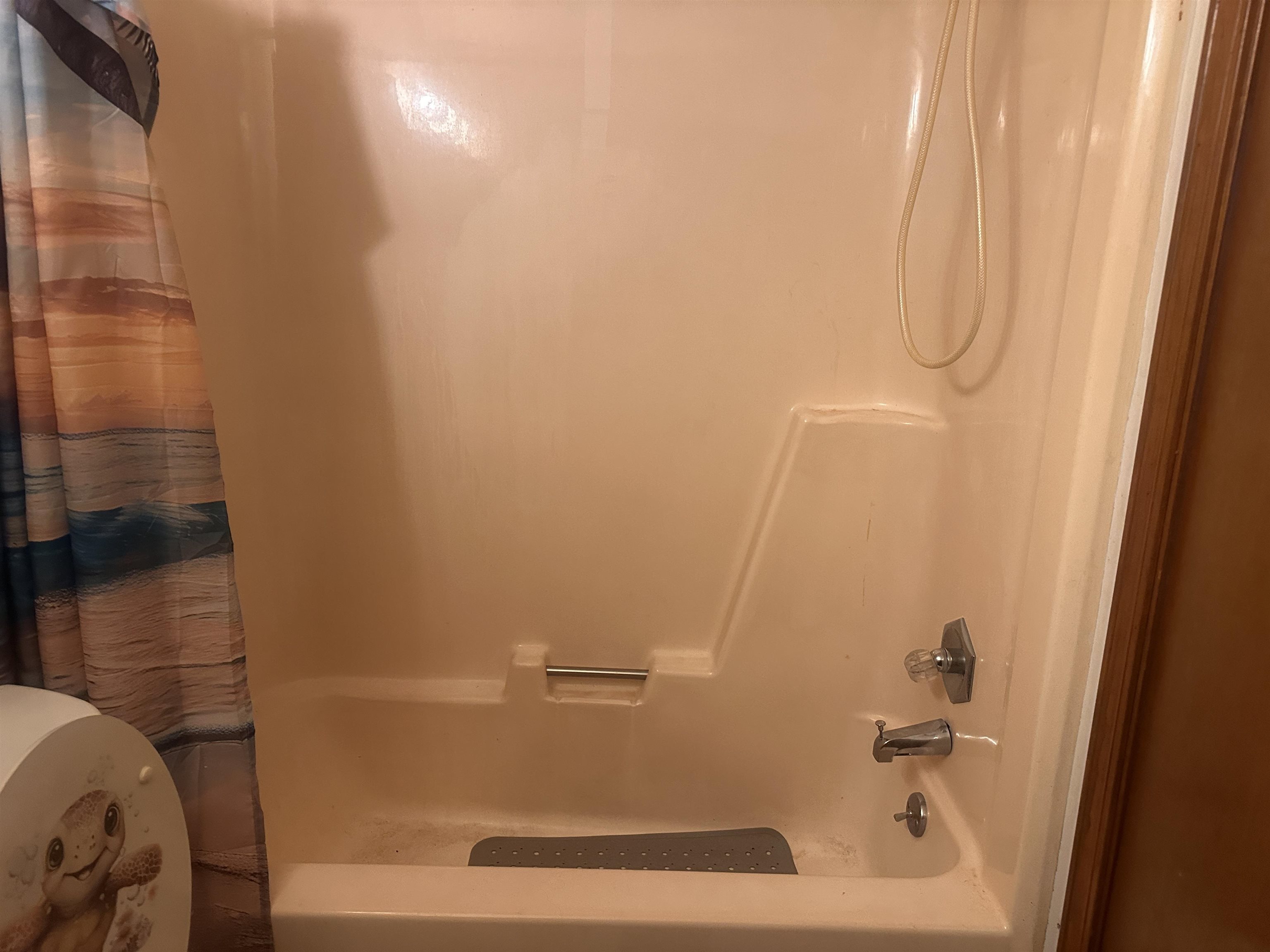 605 Jr Drive Covington, TN 38019 - Photo 14 of 21 Bathroom featuring shower / bathtub combination with curtain