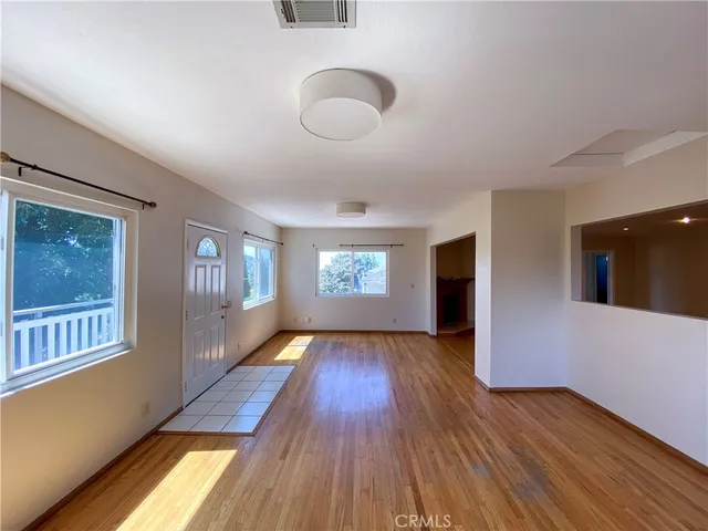 a view of gallery with wooden floor